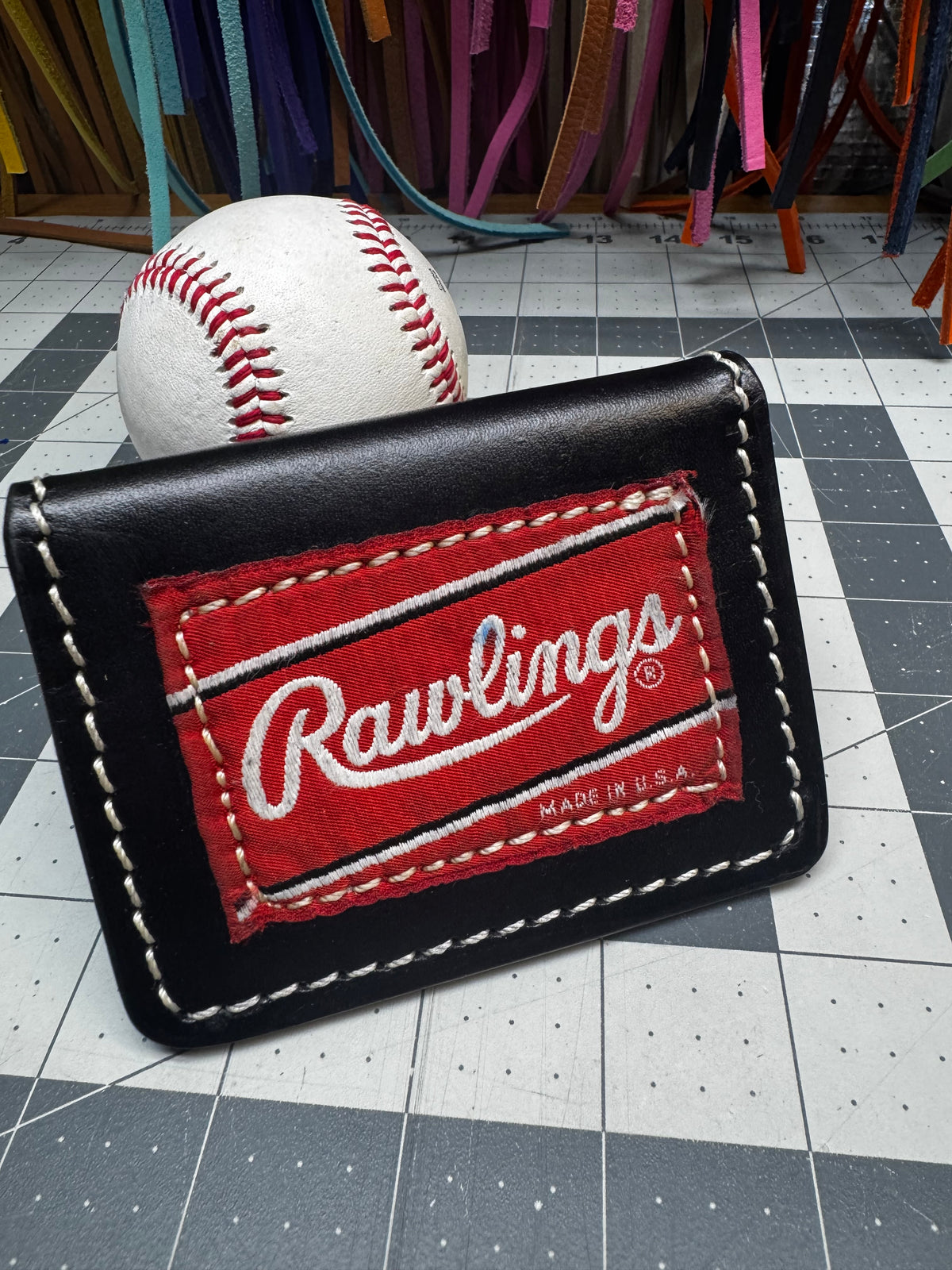 Genuine Rawlings glove patch on handmade black baseball wallet